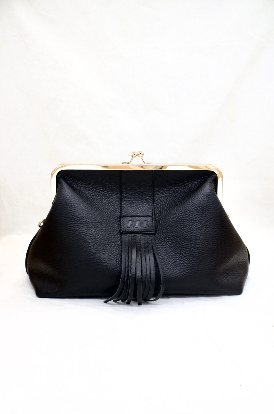 Sac à fermoir avec frange tout en cuir
